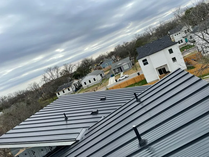 Standing seam metal roof panels with vents for Skylight Repair in Southfield